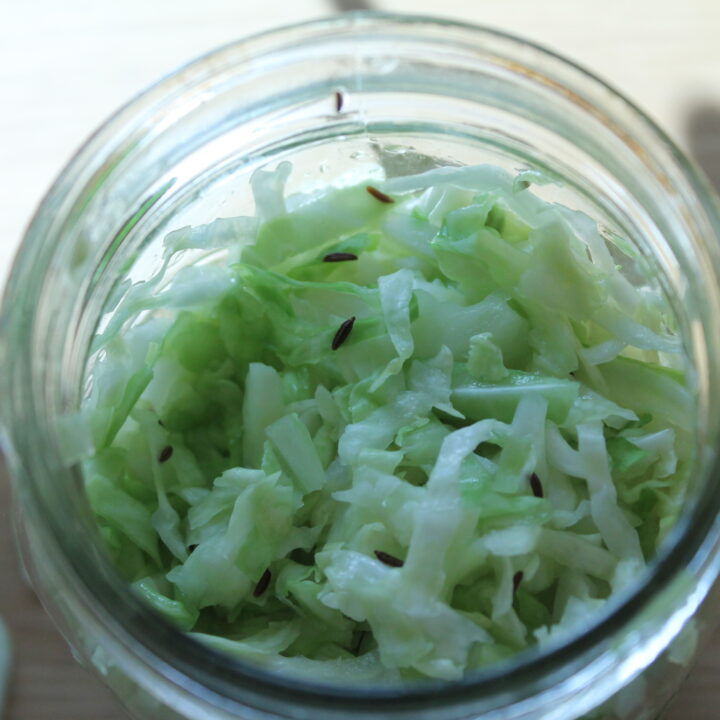 salted cabbage in jar to make Sauerkraut for Gut Health