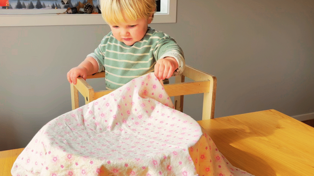 Toddler peeking at the rising dough for tiger loaf