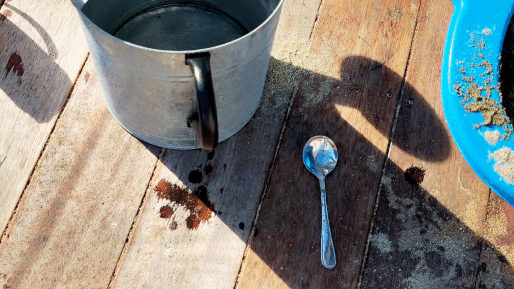 stainless steel spoon and watering can for messy outdoor play