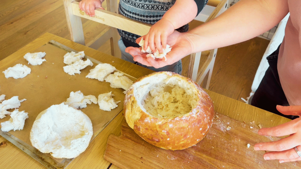 Toddler helping to make pumpkin and sage cob loaf