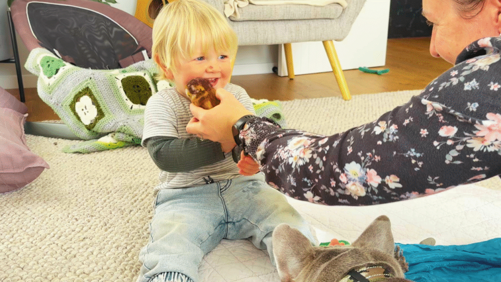 mum bringing a story to life for toddler with owl prop