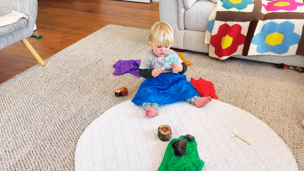 toddler touching waldorf inspired props for story telling