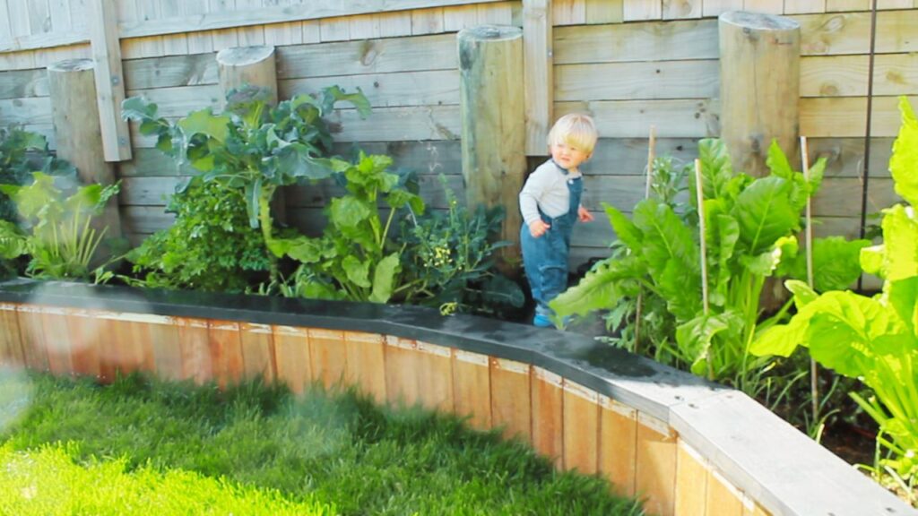 Toddler helping in the garden