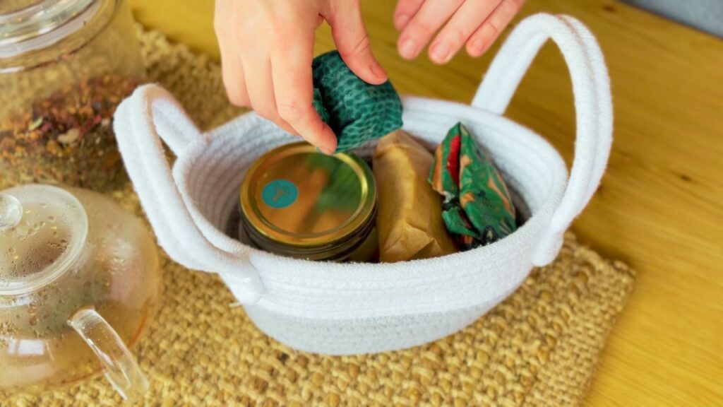 Mom packing travel snacks into basket