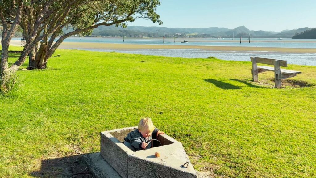 Toddler enjoying our Waldorf family rhythm while traveling to the beach