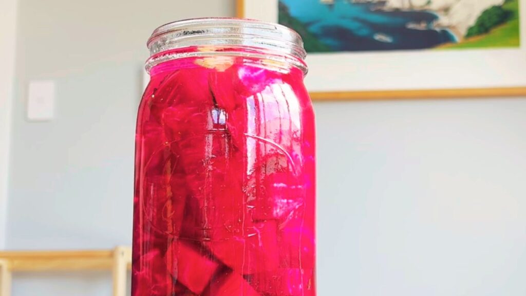 Finished beetroot kvass showing vibrant colour after fermentation