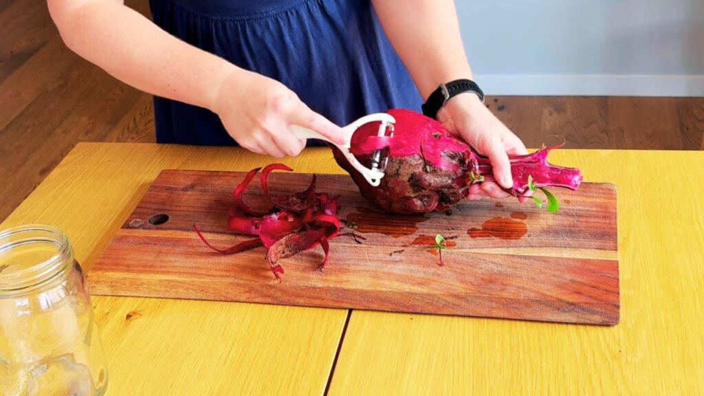 Peeling fresh beetroot as the first step in a simple beetroot kvass recipe