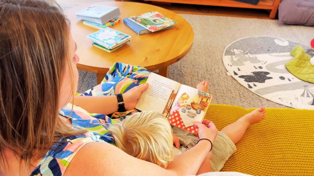 Reading together on the couch as part of a gentle morning rhythm with a toddler