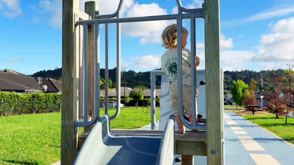 Toddler playing at the park in the morning as part of a gentle daily rhythm