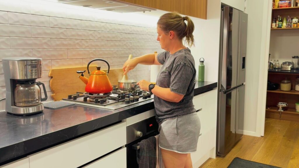 mother cooking quietly in the kitchen during a calm family morning